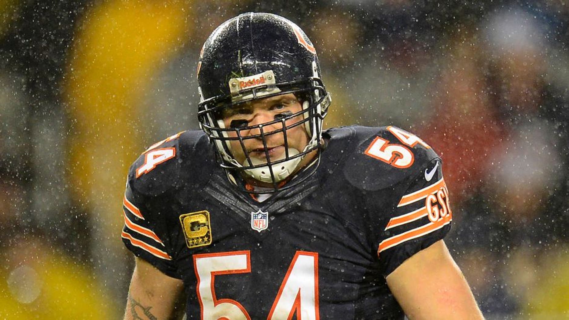 Nov 11, 2012; Chicago, IL, USA; Chicago Bears middle linebacker Brian Urlacher (54) reacts after making a play against the Houston Texans during the second quarter at Soldier Field. Mandatory Credit: Mike DiNovo-USA TODAY Sports