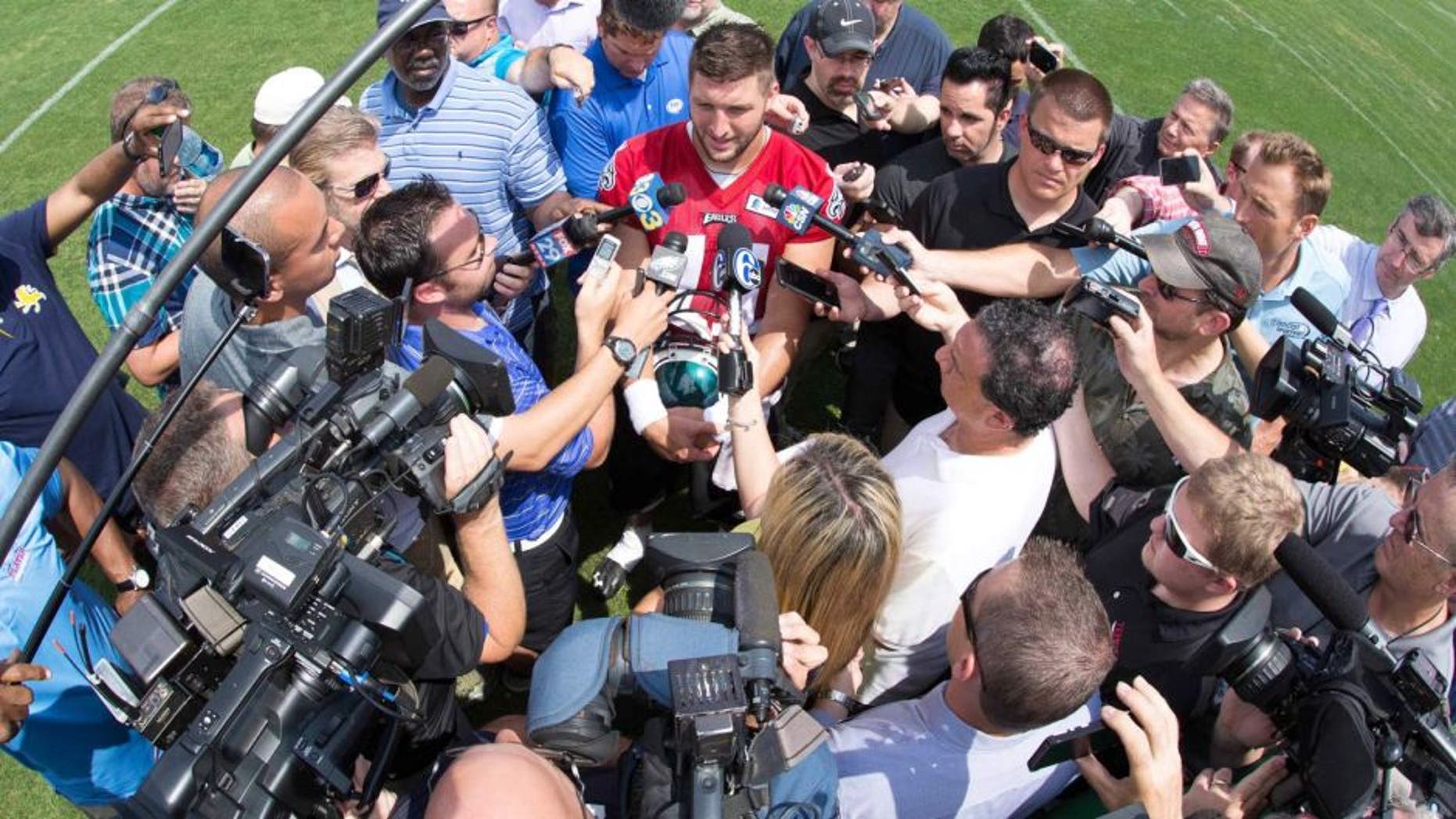 May 28, 2015; Philadelphia, PA, USA; Philadelphia Eagles quarterback Tim Tebow (11) talks to the media during OTA's at the NovaCare Complex. Mandatory Credit: Bill Streicher-USA TODAY Sports