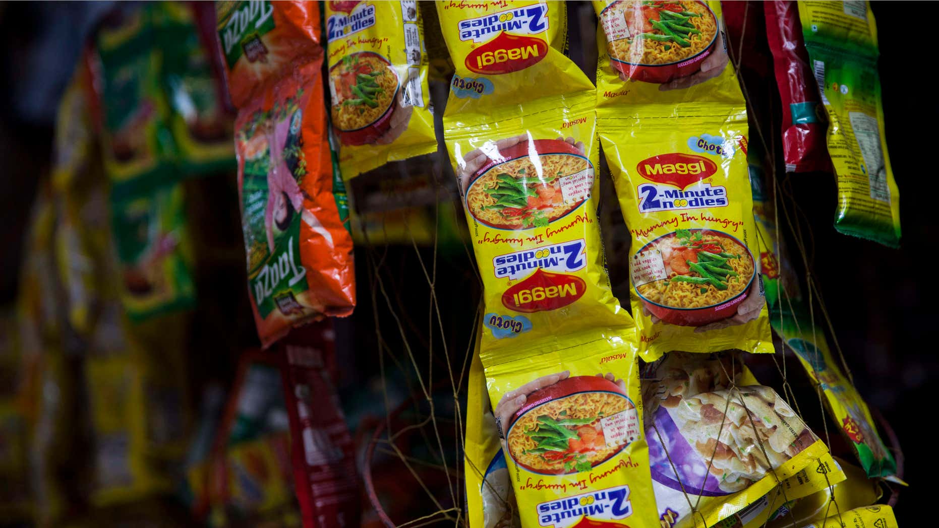 June 3, 2015: Packets of Maggi noodles hang on display at a shop in New Delhi, India.