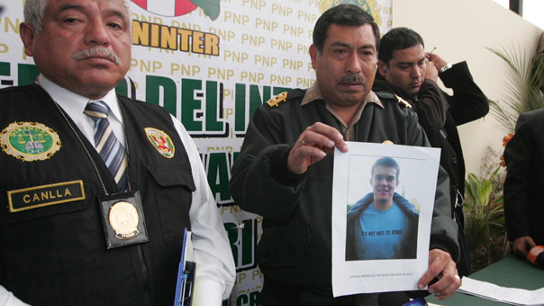 June 2: Police show a photo of Dutch citizen Joran van der Sloot at a news conference in Lima.