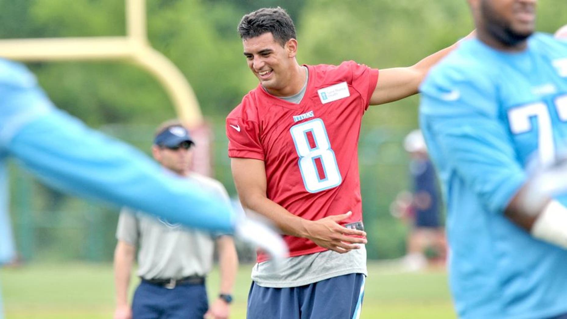 May 15, 2015; Nashville, TN, USA; Tennessee Titans first round draft pick quarterback Marcus Mariota (8) works out during minicamp at Saint Thomas Sports Park. Mandatory Credit: Jim Brown-USA TODAY Sports