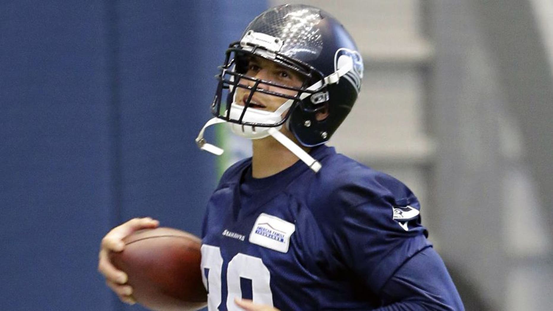 Seattle Seahawks tight end Jimmy Graham (88) runs with the ball during an organized team activity Tuesday, June 2, 2015, in Renton, Wash. (AP Photo/Ted S. Warren)