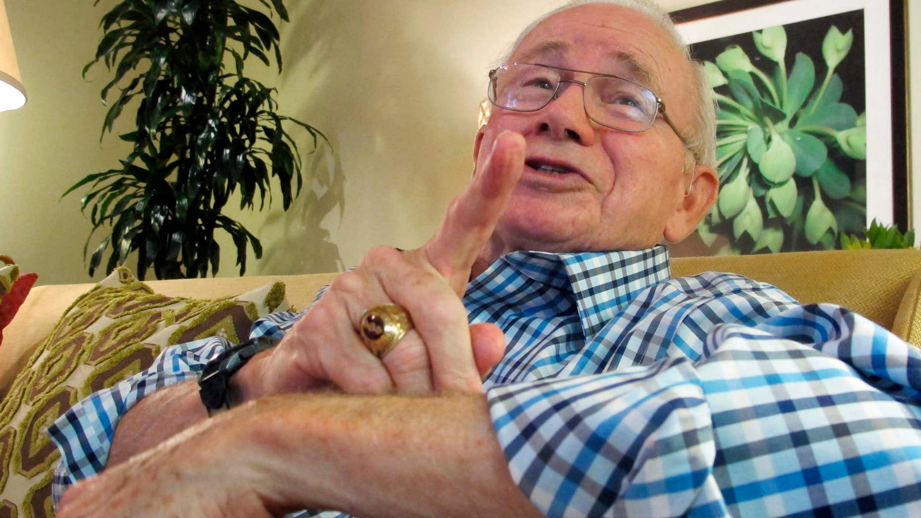FILE - In this Nov. 26, 2013, file photo, retired Air Force Col. Thomas E. Schaefer discusses his 444 days in captivity in Iran, at his home in Scottsdale, Ariz.