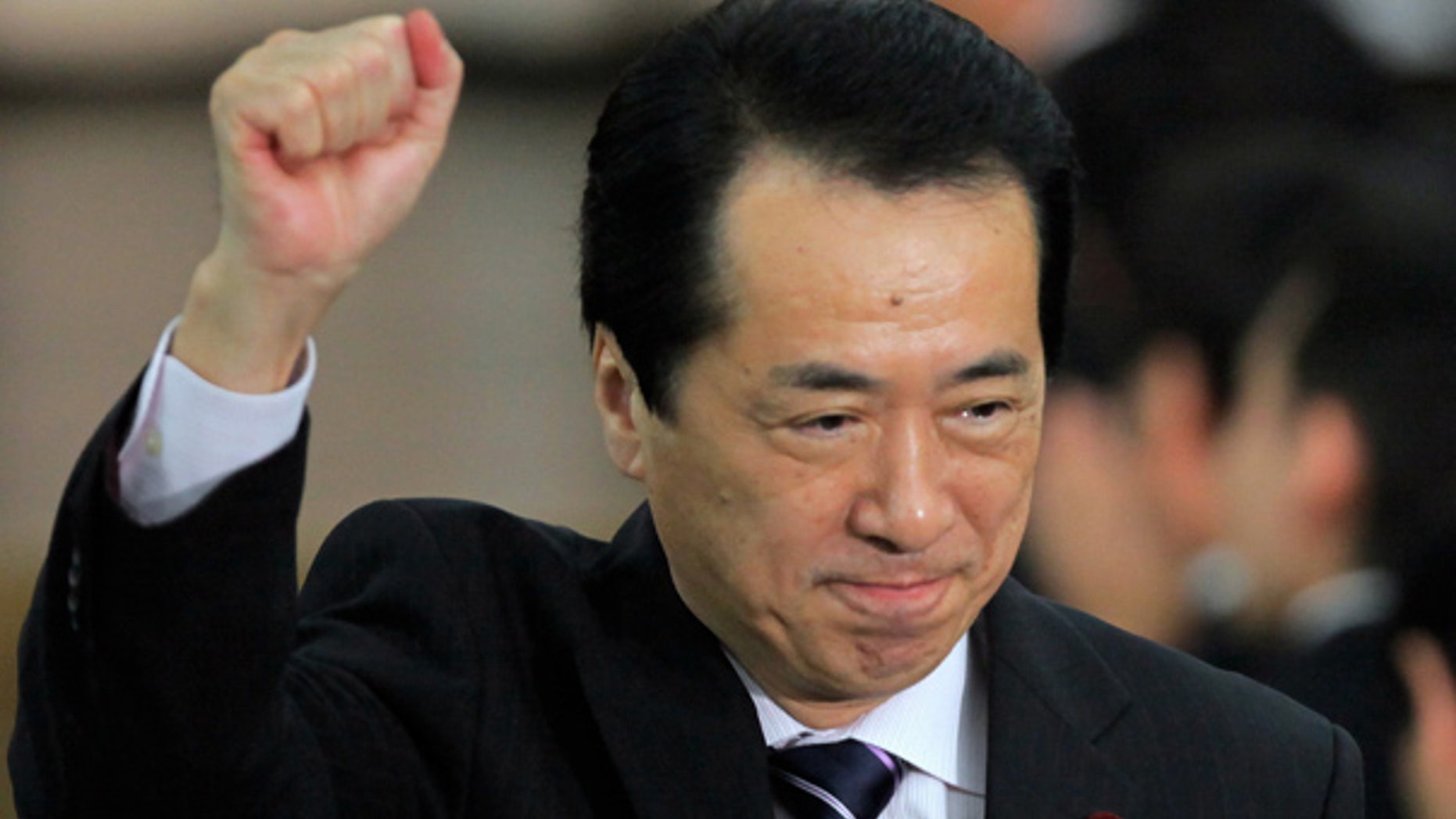 June 4: Japan's newly-elected Prime Minister Naoto Kan cheers lawmakers of his Democratic Party of Japan in Tokyo.