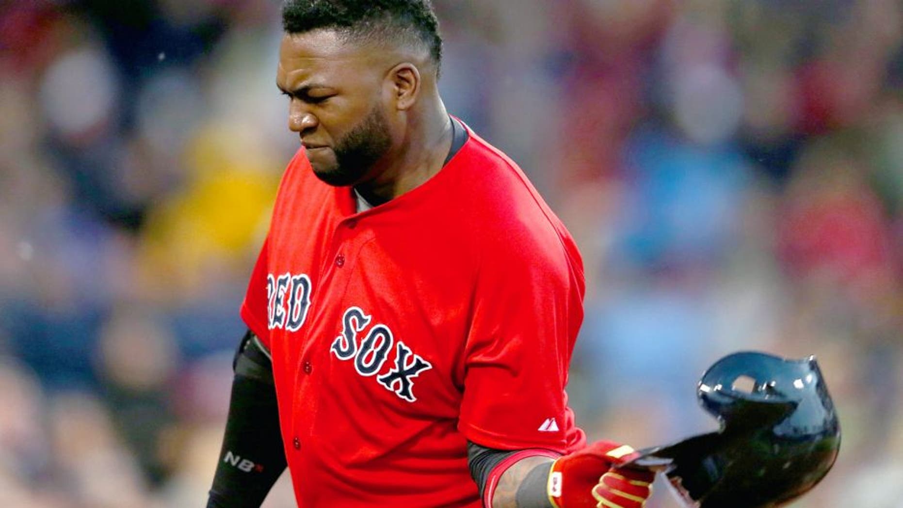 BOSTON, MA - JUNE 3: David Ortiz #34 of the Boston Red Sox throws his helmet after making an out in the fourth inning against the Minnesota Twins during the second game of a doubleheader at Fenway Park on June 3, 2015 in Boston, Massachusetts. (Photo by Jim Rogash/Getty Images)
