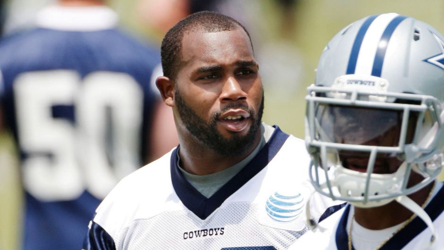 Dallas Cowboys running backs Joseph Randle (21) and Darren McFadden (20) look on during an NFL football organized team activity, Wednesday, May 27, 2015, in Irving, Texas. (AP Photo/Brandon Wade)