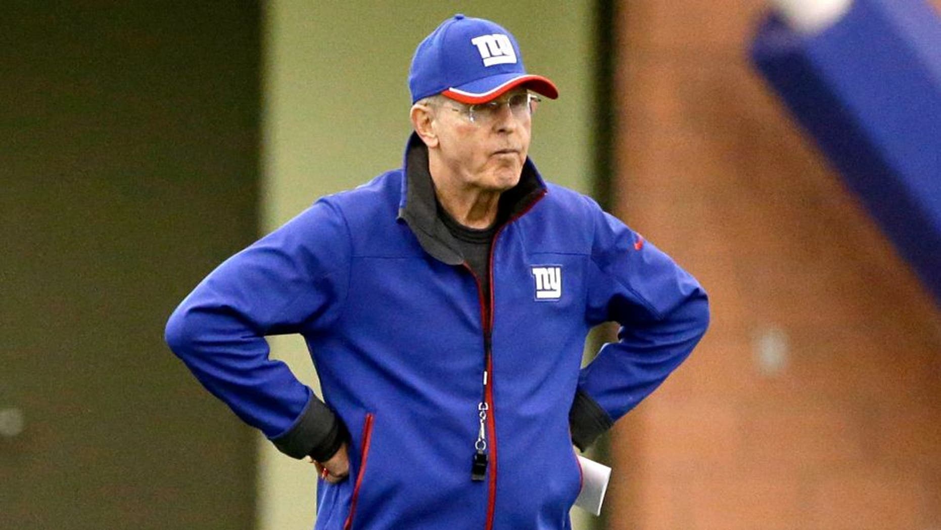 New York Giants head coach Tom Coughlin walks on the field during organized team activity in East Rutherford, N.J., Monday, June 1, 2015. (AP Photo/Seth Wenig)