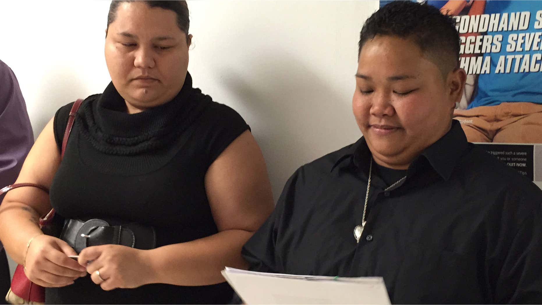 April 8, 2015: Loretta M. Pangelinan, 28, right, holds the application for a marriage license that she and her fiancee, Kathleen M. Aguero, 28, will turn in at the Office of Vital Statistics in the Guam Department of Public Health and Social Services.