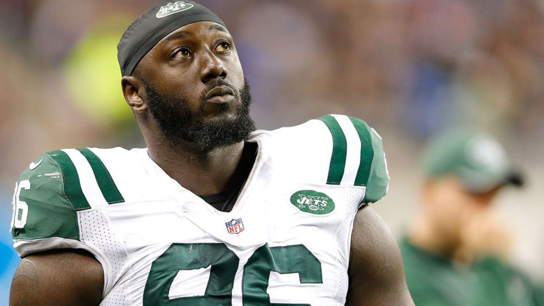 DETROIT, MI - NOVEMBER 24: Muhammad Wilkerson #96 of the New York Jets watches the action from the silde lines during the game against the Buffalo Bills at Ford Field on November 24, 2014 in Detroit, Michigan. The Bills defeated the Jets 38-3. (Photo by Leon Halip/Getty Images)