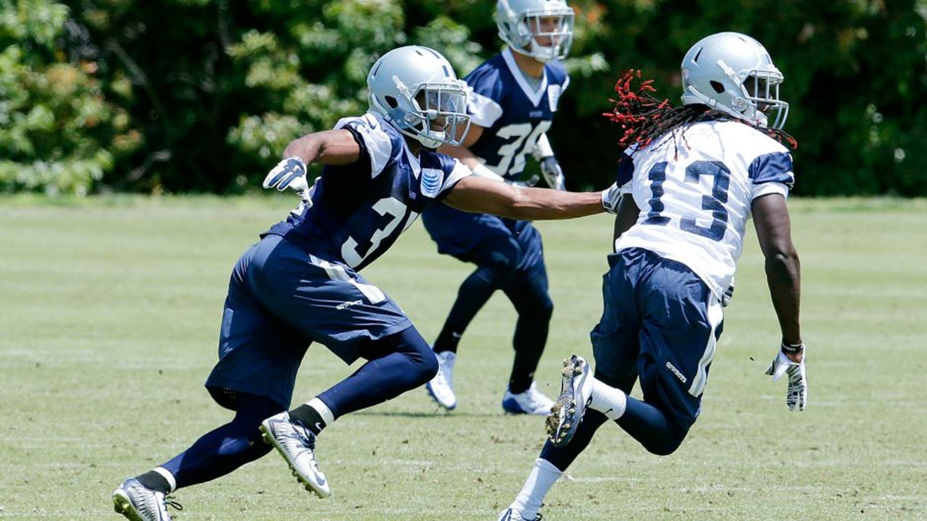May 27, 2015; Dallas, TX, USA; Dallas Cowboys cornerback Byron Jones (31) covers receiver Lucky Whitehead (13) during OTAs at Dallas Cowboys Headquarters. Mandatory Credit: Matthew Emmons-USA TODAY Sports