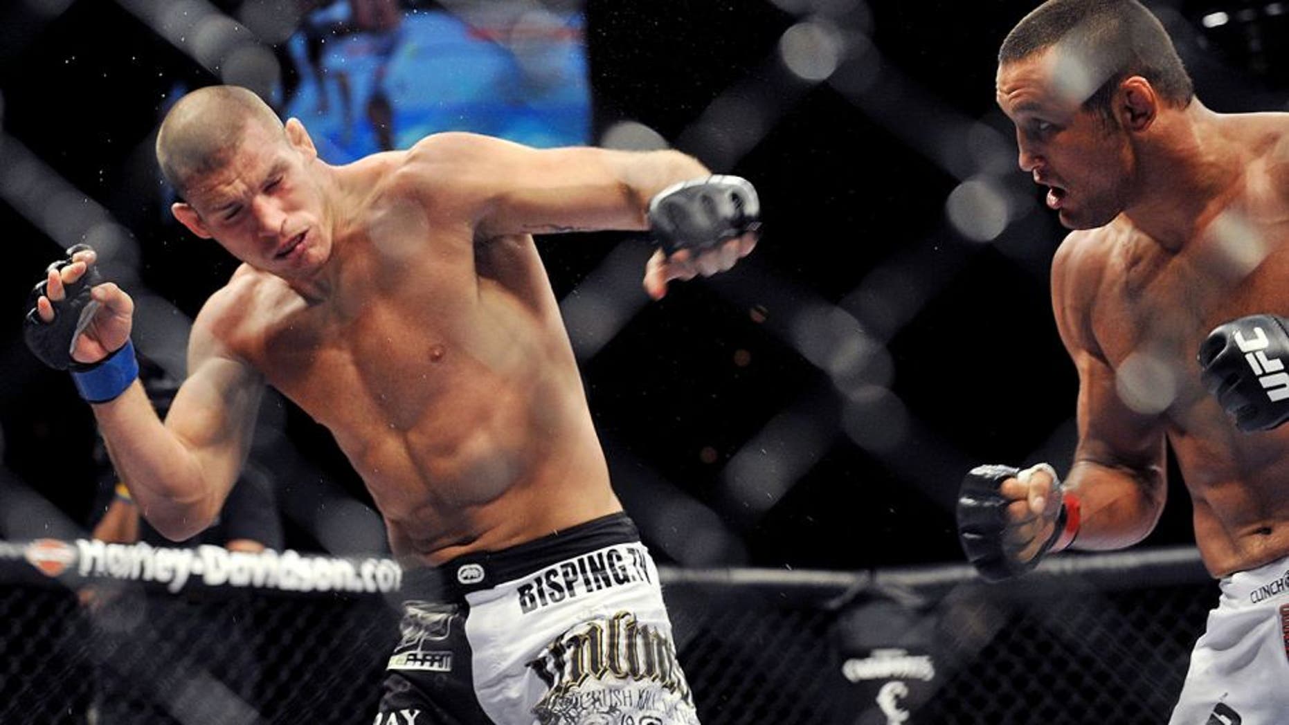 LAS VEGAS - JULY 11: UFC Middleweights Dan Henderson (R) battles Michael Bisping (L) during their Middleweight bout at UFC 100 the Mandalay Bay Hotel and Casino on July 11, 2009 in Las Vegas, Nevada. (Photo by Jon Kopaloff/Getty Images)