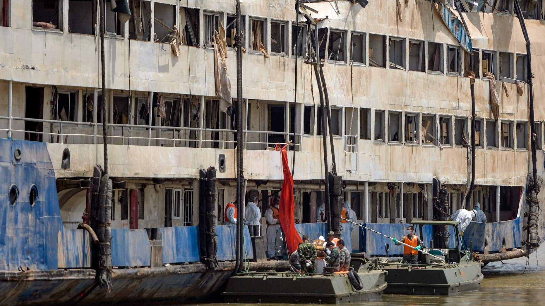 June 6, 2015: In this photo released by China's Xinhua News Agency, rescuers work in the hull of the upright Eastern Star ship to launch rescue work in the section of Jianli on the Yangtze River, central China's Hubei Province.