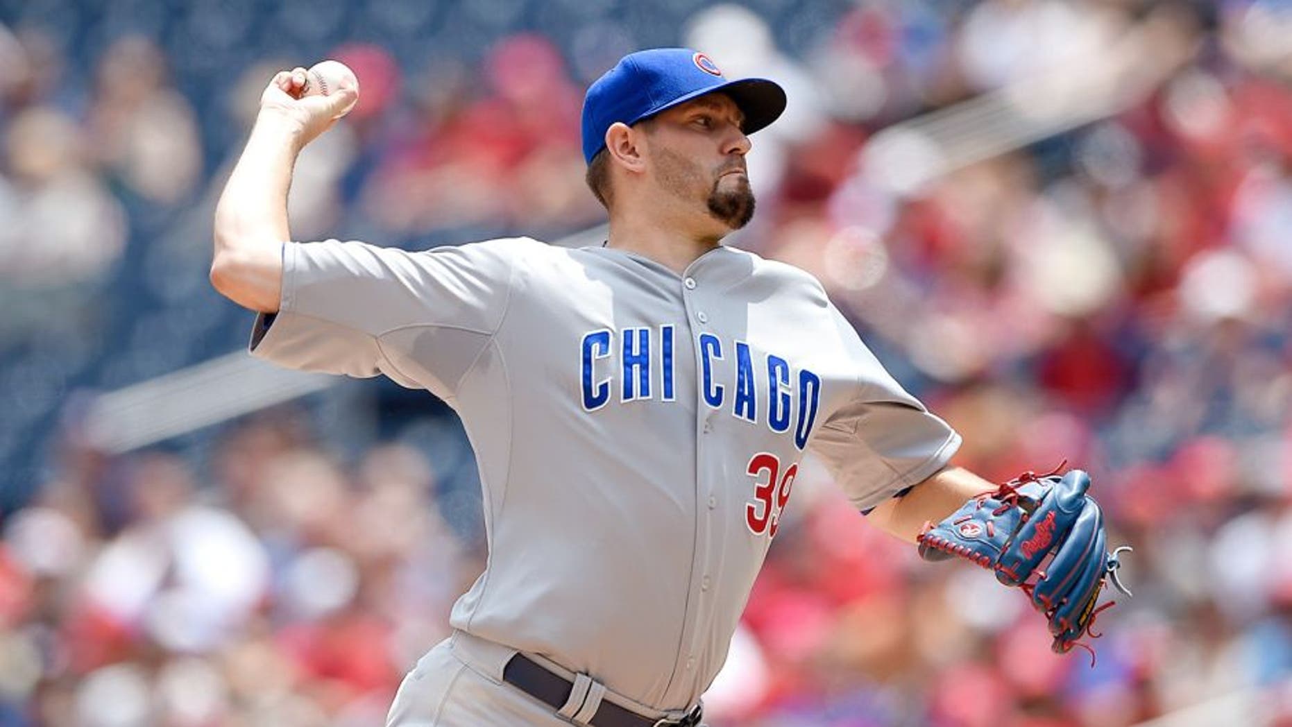 Chicago Cubs starting pitcher Jason Hammel delivers a pitch against the Washington Nationals during the first inning of a baseball game, Saturday, June 6, 2015, in Washington. (AP Photo/Nick Wass)