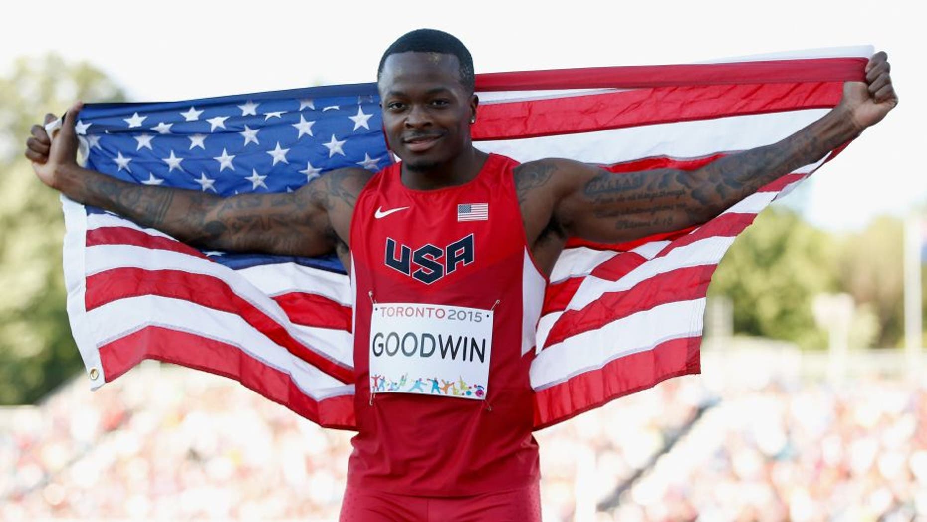 TORONTO, ON - JULY 22: Marquise Goodwin of the United States holds the American flag after winning the silver medal in the men's long jump during Day 12 of the Toronto 2015 Pan Am Games on July 22, 2015 in Toronto, Canada. (Photo by Ezra Shaw/Getty Images)