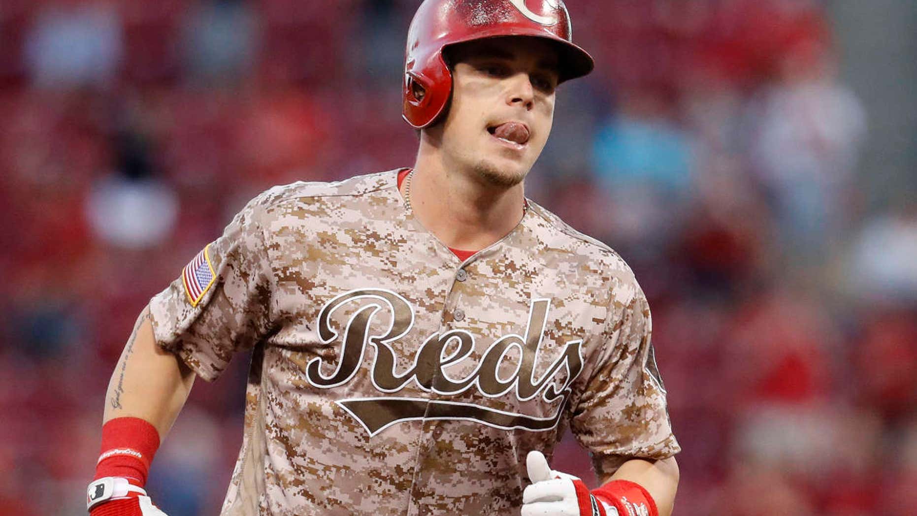 Cincinnati Reds' Scooter Gennett runs the bases after hitting a two-run home run off St. Louis Cardinals relief pitcher John Gant in the fourth inning of a baseball game, Tuesday, June 6, 2017, in Cincinnati.