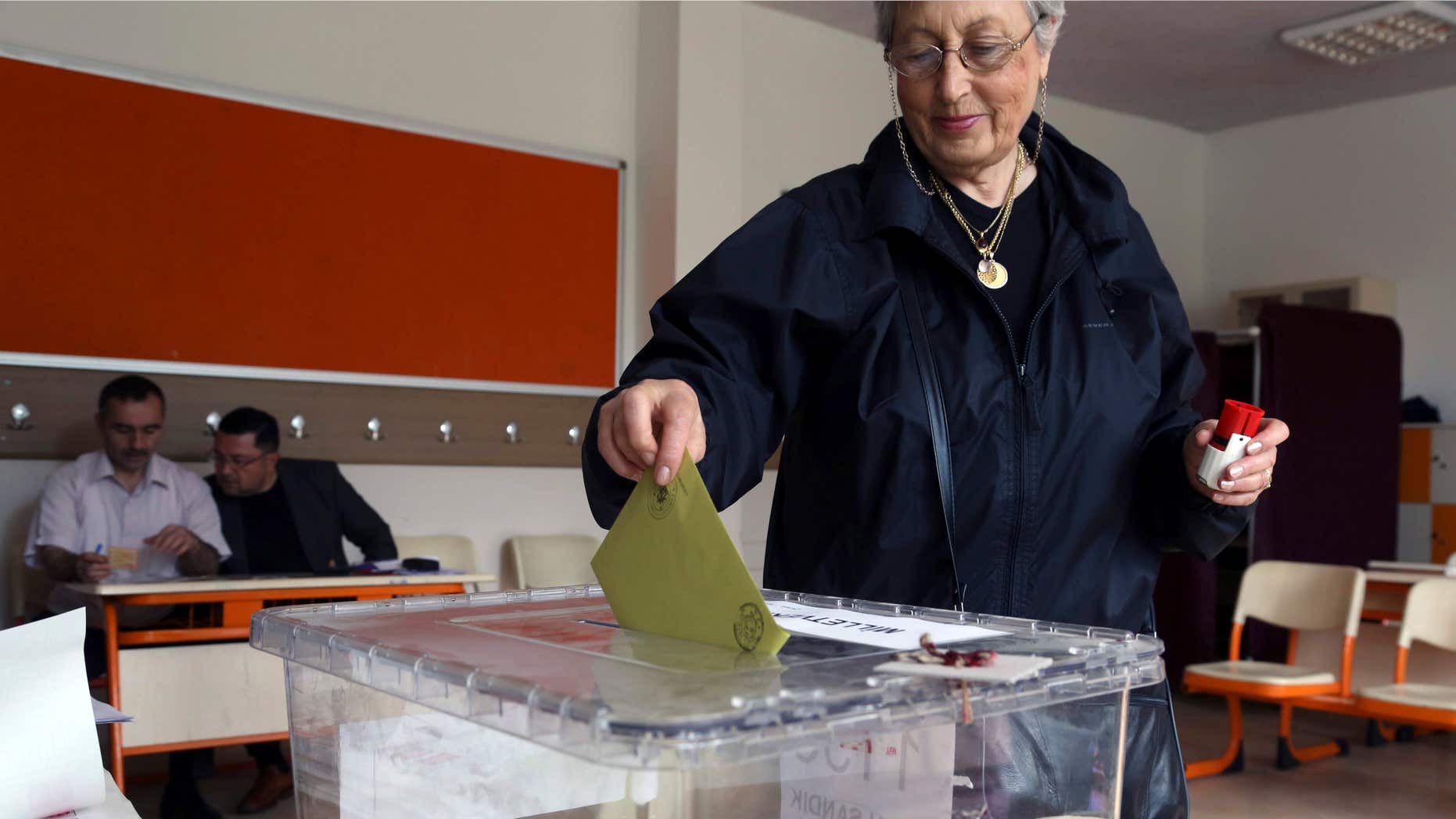 June 7, 2015: Turkish woman Emine Melike Ozmumcu casts her vote at a polling station in a primary school in Ankara, Turkey.