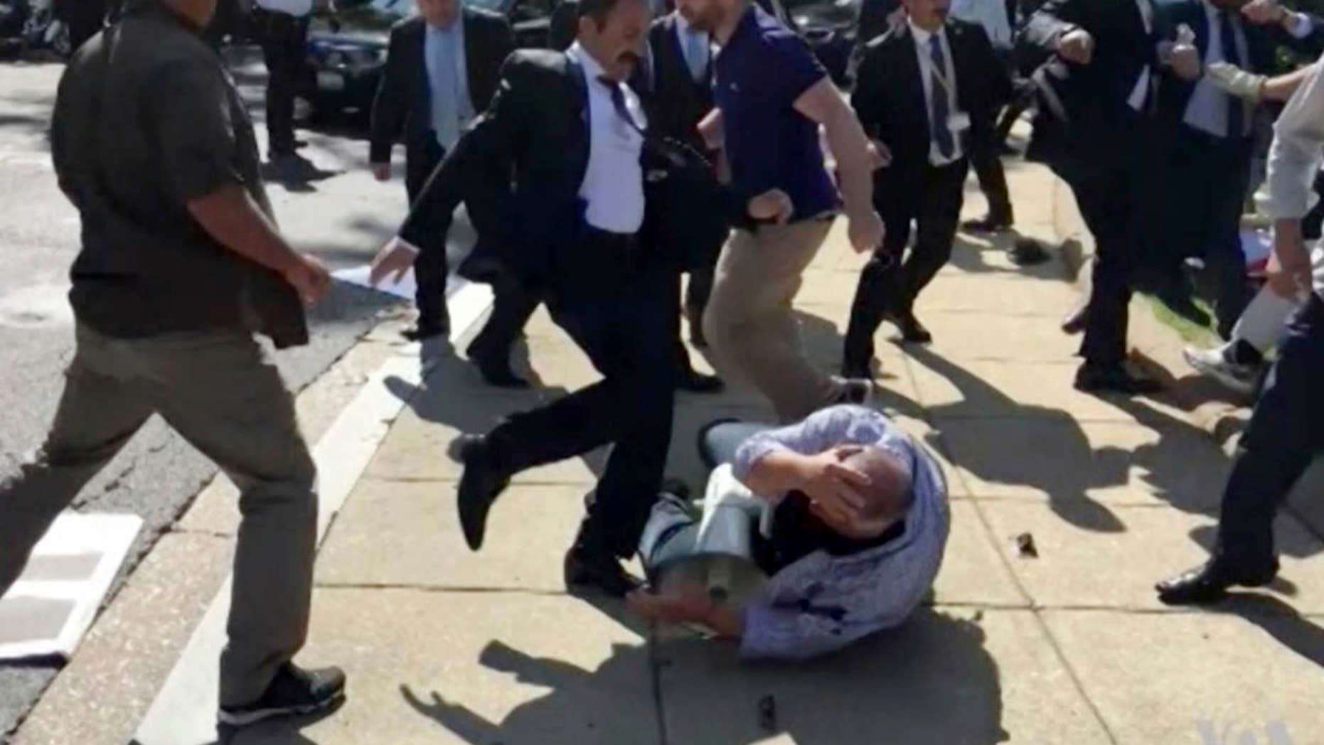 In this frame grab from video provided by Voice of America, members of Turkish President Recep Tayyip Erdogan’s security detail are shown violently reacting to peaceful protesters during Erdogan's trip last month to Washington.
