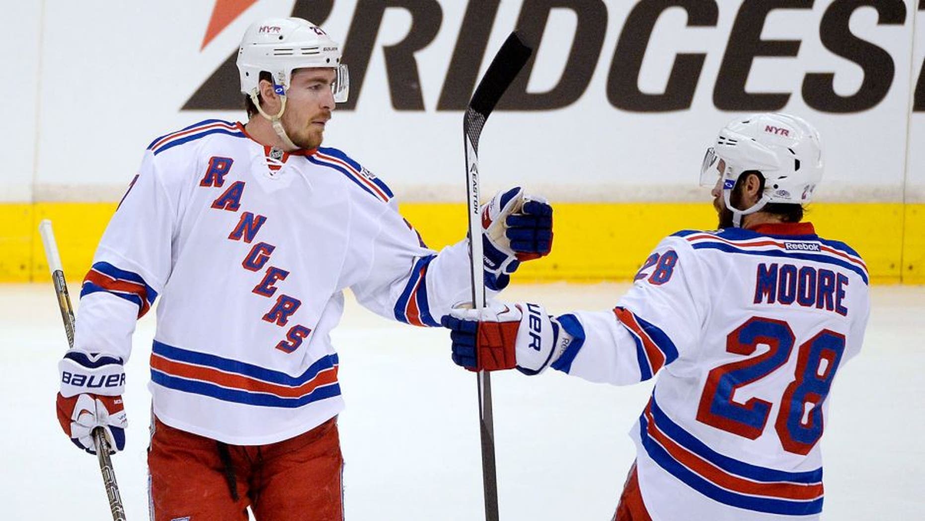 Jun 7, 2014; Los Angeles, CA, USA; New York Rangers defenseman Ryan McDonagh (27) celebrates with center Dominic Moore (28) after scoring a goal against the Los Angeles Kings in the first period during game two of the 2014 Stanley Cup Final at Staples Center. Mandatory Credit: Richard Mackson-USA TODAY Sports