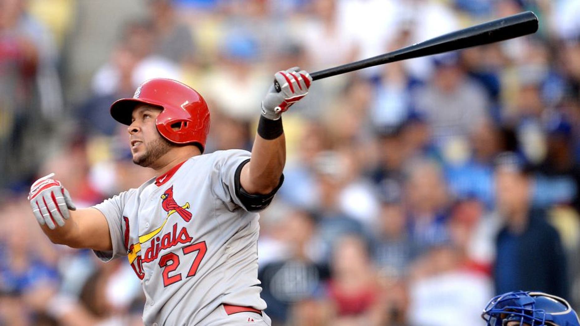 Jun 7, 2015; Los Angeles, CA, USA; St. Louis Cardinals shortstop Jhonny Peralta (27) hits a solo home run in the sixth inning of the game against the Los Angeles Dodgers at Dodger Stadium. Mandatory Credit: Jayne Kamin-Oncea-USA TODAY Sports