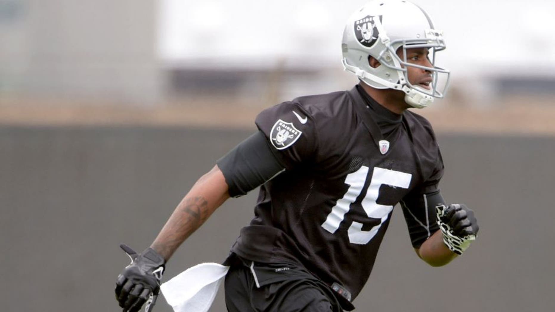 May 26, 2015; Alameda, CA, USA; Oakland Raiders receivefr Michael Crabtree (15) at organized team activities at the Raiders practice facility. Mandatory Credit: Kirby Lee-USA TODAY Sports