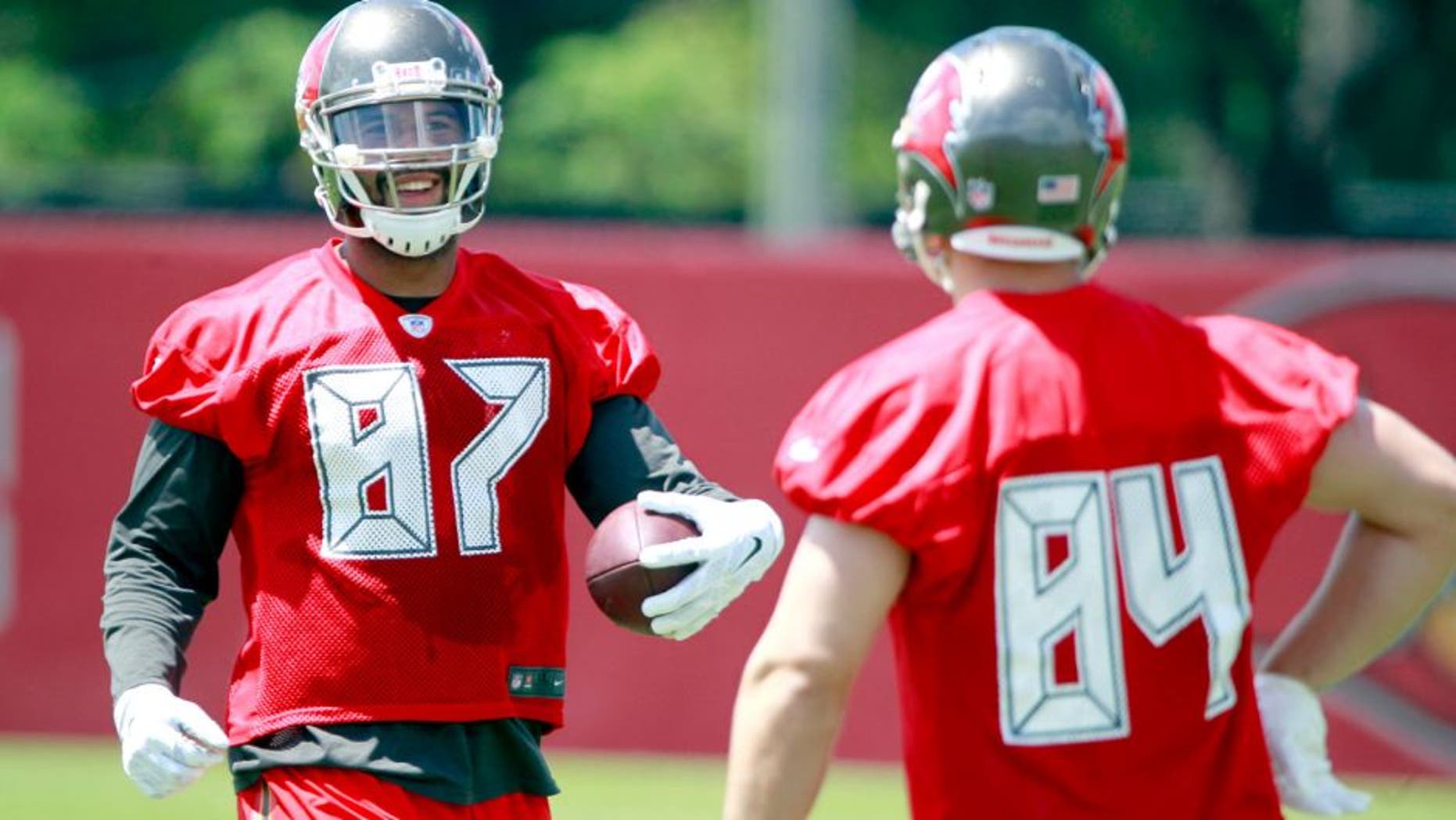 May 28, 2015; Tampa, FL, USA; Tampa Bay Buccaneers tight end Austin Seferian-Jenkins (87) and tight end Cameron Brate (84) smile as they work out at One Buc Place. Mandatory Credit: Kim Klement-USA TODAY Sports