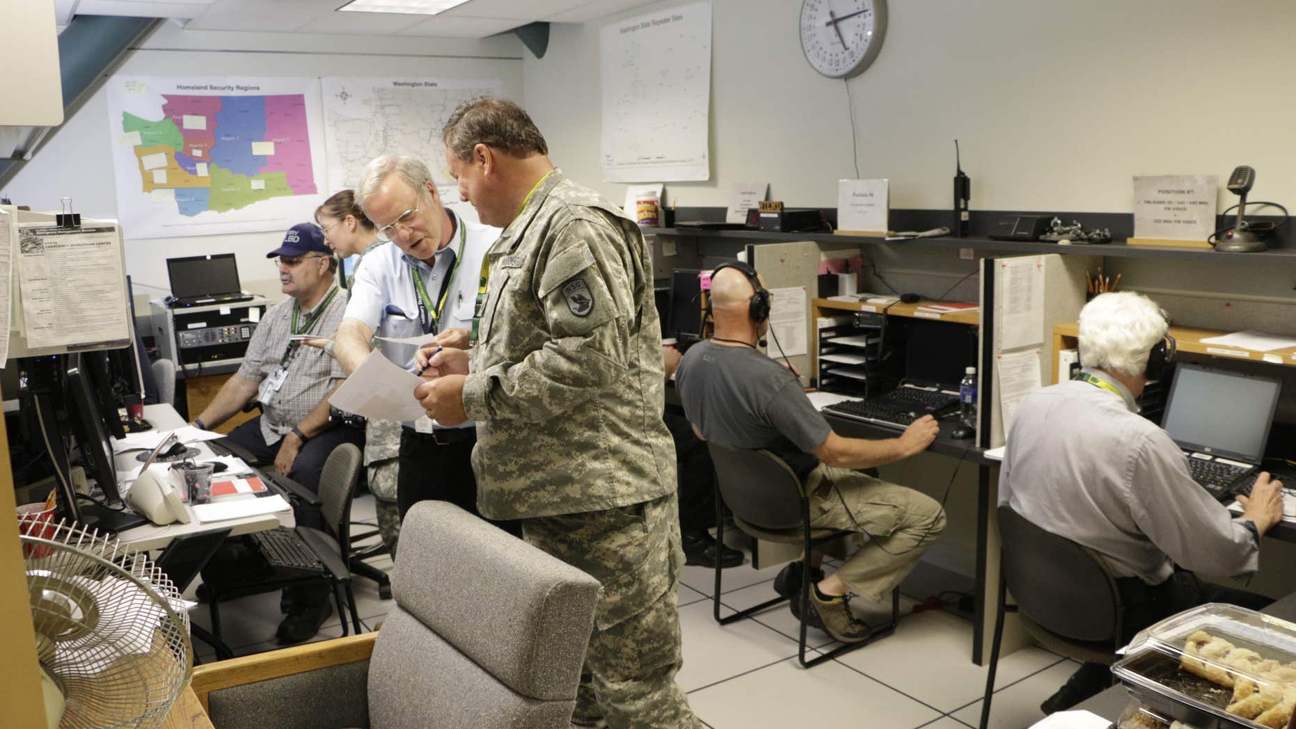 Volunteer radio operators participate in an earthquake and tsunami readiness drill, Tuesday, June 7, 2016, at Camp Murray, Wash.