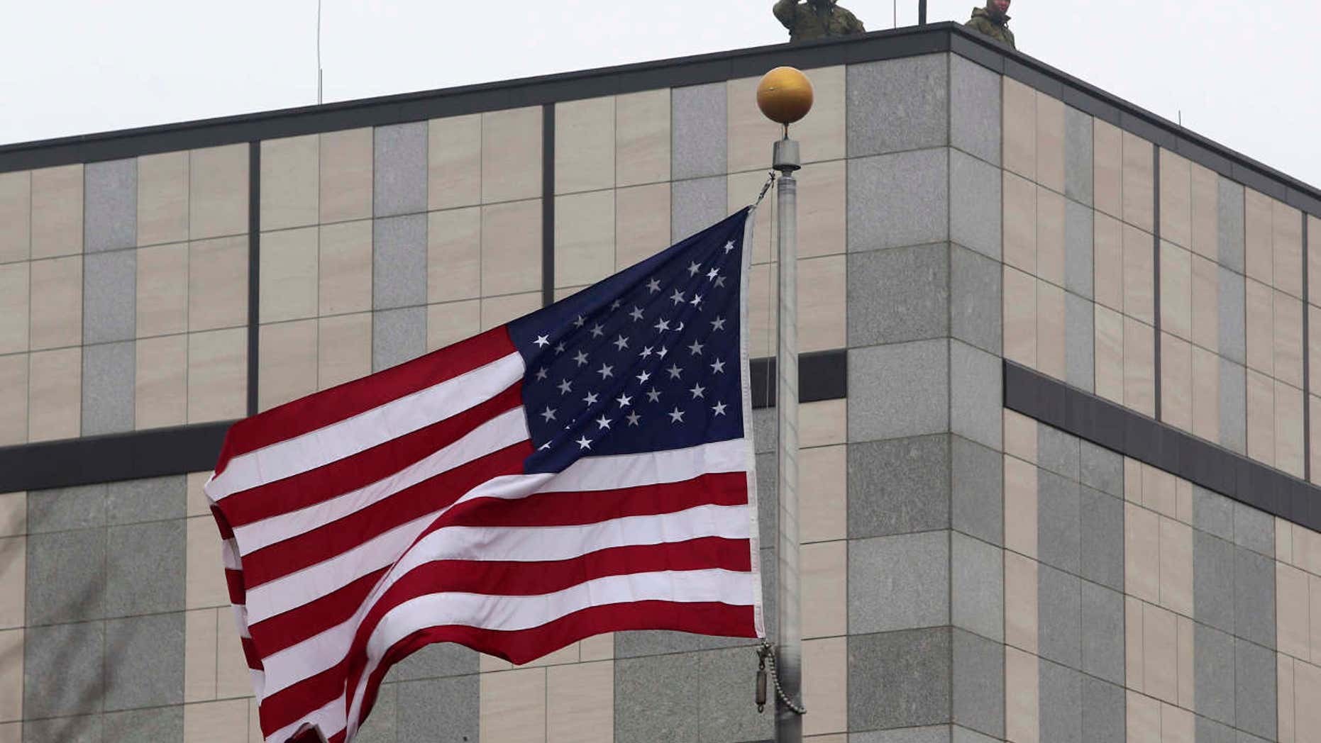 Guards are seen on the roof of the U.S. embassy in Kiev.