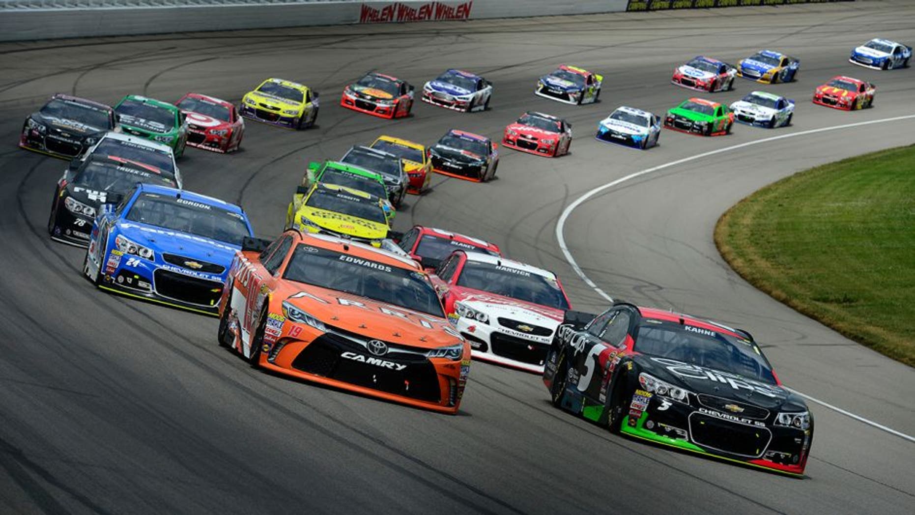 BROOKLYN, MI - JUNE 14: Carl Edwards, driver of the #19 ARRIS Toyota, and Kasey Kahne, driver of the #5 Great Clips Chevrolet, lead a pack of cars during the NASCAR Sprint Cup Series Quicken Loans 400 at Michigan International Speedway on June 14, 2015 in Brooklyn, Michigan. (Photo by Robert Laberge/NASCAR via Getty Images)
