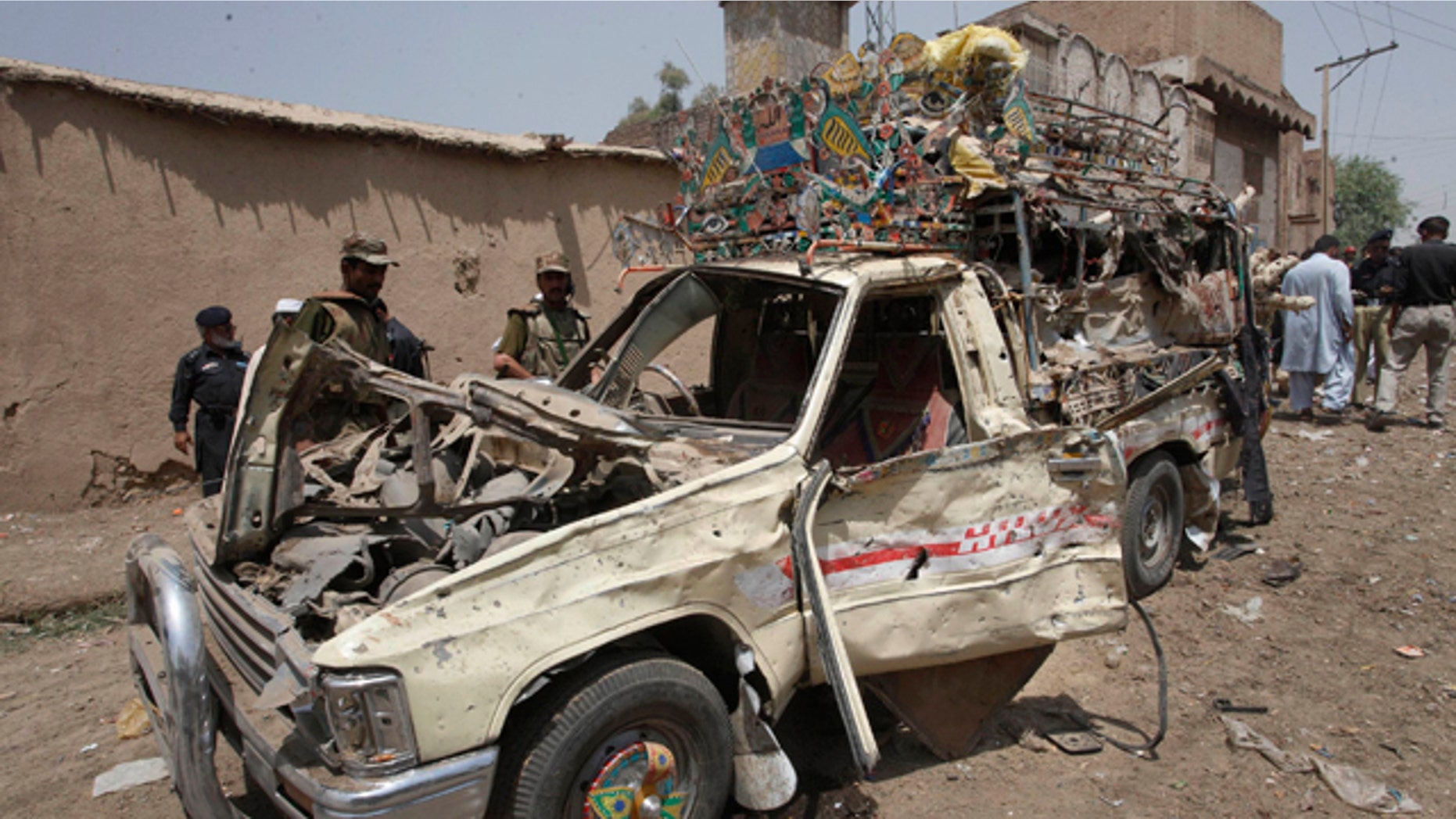June 9: Pakistani security officials visit the site of a blast in Matani Near Peshawar, Pakistan.