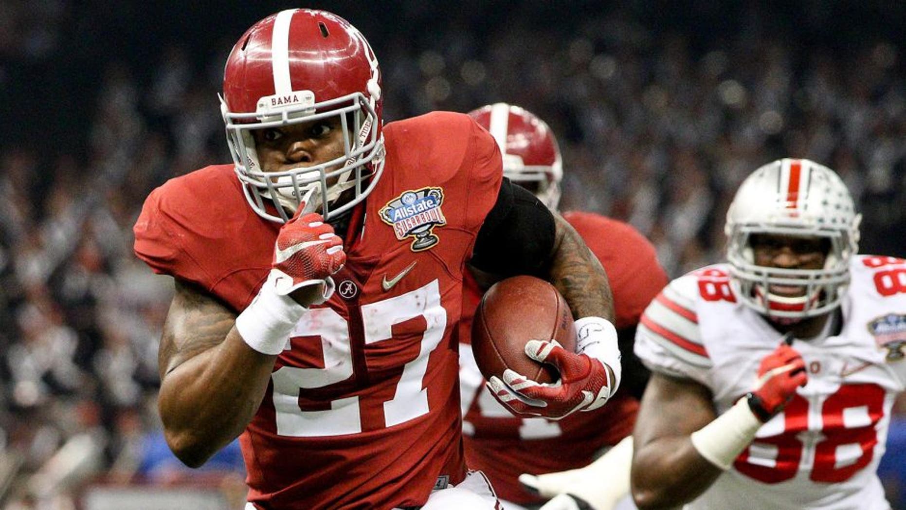 Jan 1, 2015; New Orleans, LA, USA; Alabama Crimson Tide running back Derrick Henry (27) runs past Ohio State Buckeyes defensive lineman Steve Miller (88) during the first quarter of the 2015 Sugar Bowl at Mercedes-Benz Superdome. Mandatory Credit: Derick E. Hingle-USA TODAY Sports