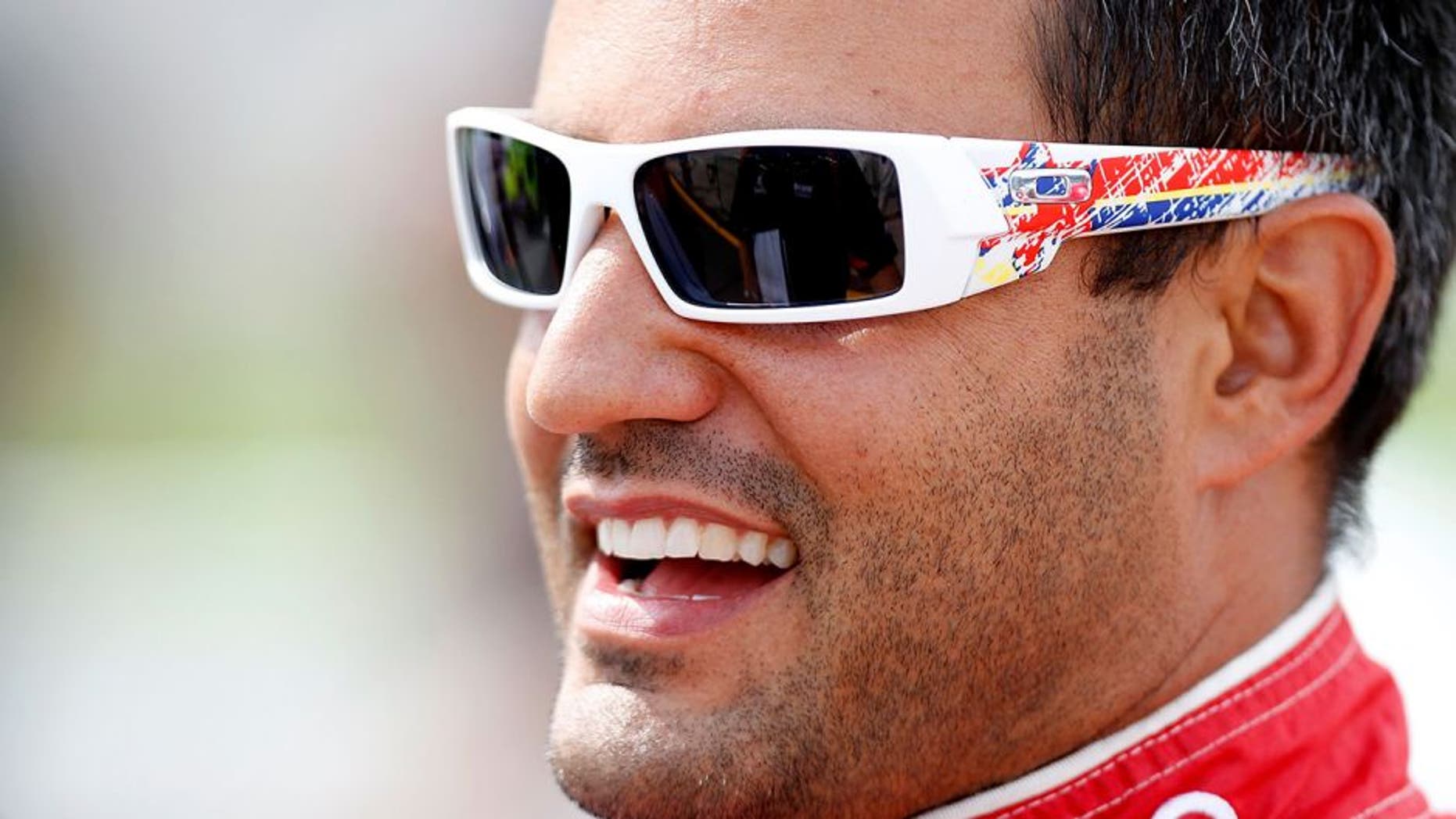 BROOKLYN, MI - AUGUST 13: Juan Pablo Montoya, driver of the #42 Target Chevrolet, looks on from the grid during qualifying for the NASCAR Sprint Cup Series CARFAX 400 at Michigan International Speedway on August 13, 2010 in Brooklyn, Michigan. (Photo by Jeff Zelevansky/Getty Images for NASCAR)