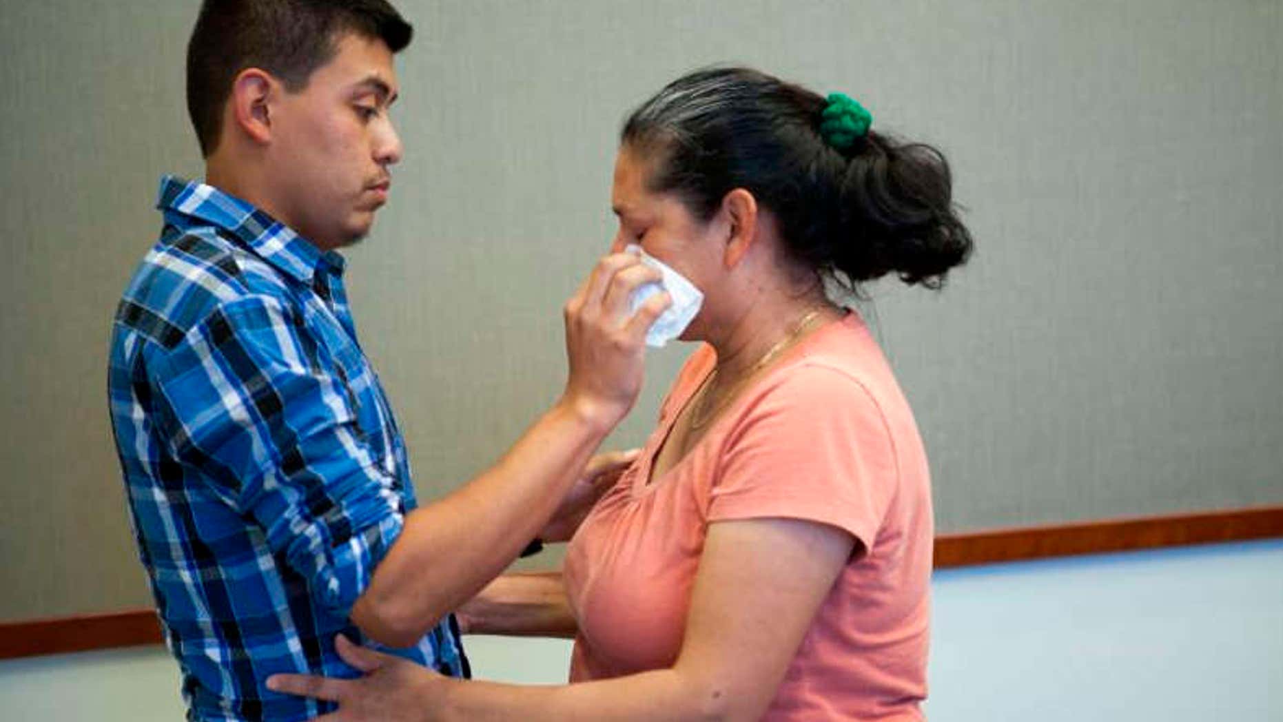 June 9, 2016: Steve Hernandez wipes a tear from his mother's eye after seeing her for the first time in 20 years in San Diego, Calif..