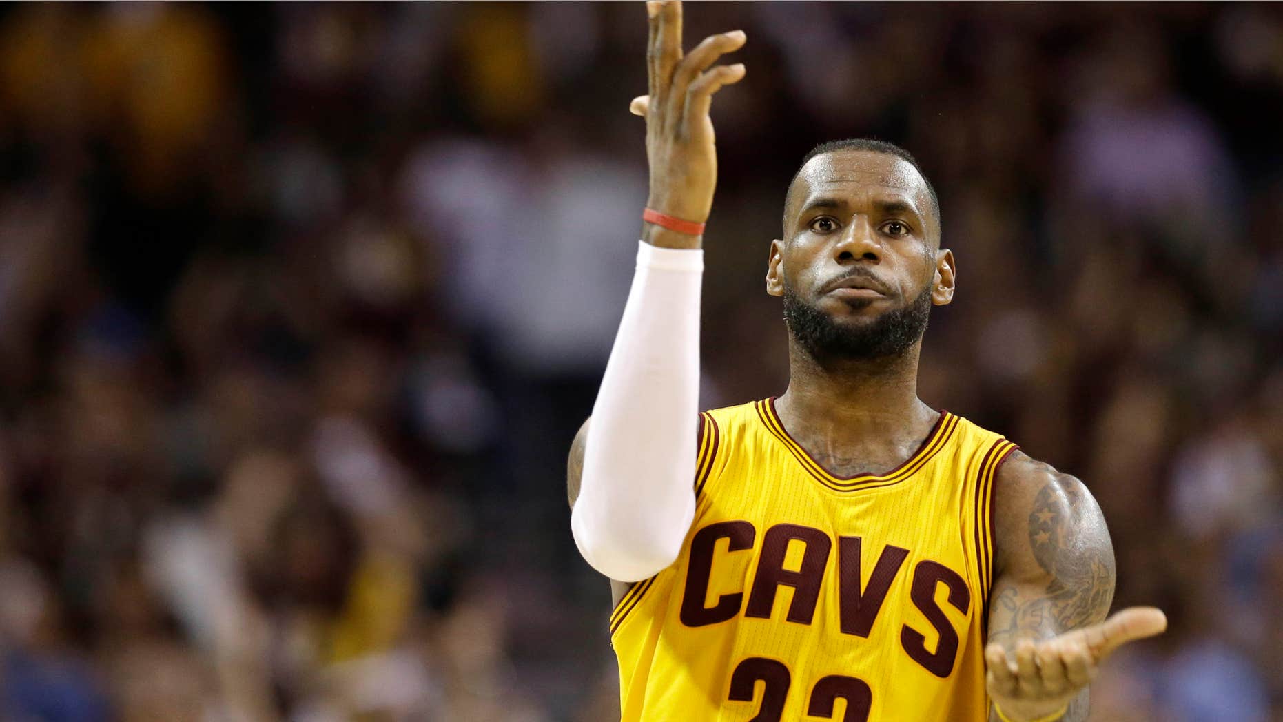 June 9, 2015: Cleveland Cavaliers forward LeBron James (23) celebrates a play against the Golden State Warriors during the second half of Game 3 of basketball's NBA Finals in Cleveland.