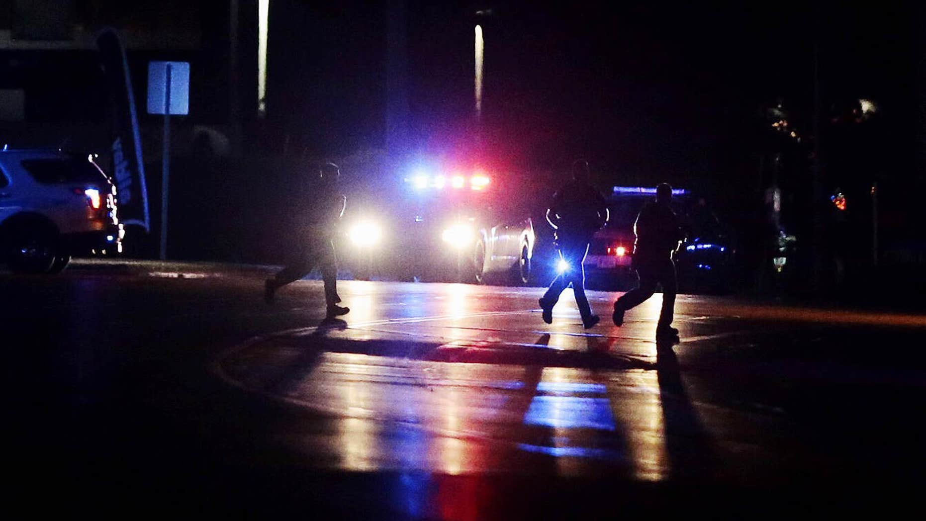 Police investigate the scene of a shooting from the intersection of Hwy 22 and Columbia Road on Thursday, June 9, 2016, in Landen, Ohio.