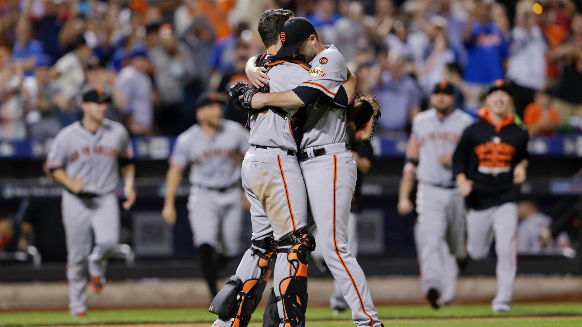 June 9, 2015: San Francisco Giants starting pitcher Chris Heston hugs catcher Buster Posey, left, after Heston's no-hitter in a baseball game against the New York Mets.