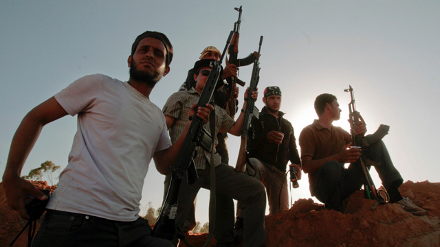 June 9: Libyan rebel fighters stand at their position at the southern front line of the city of Misrata, Libya.