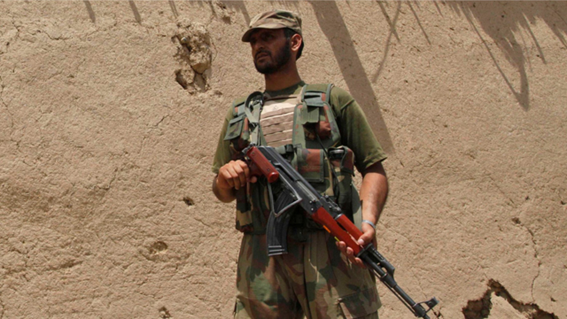 June 9: A Pakistan army soldier stands guard at the site of a blast in Matani near Peshawar, Pakistan.