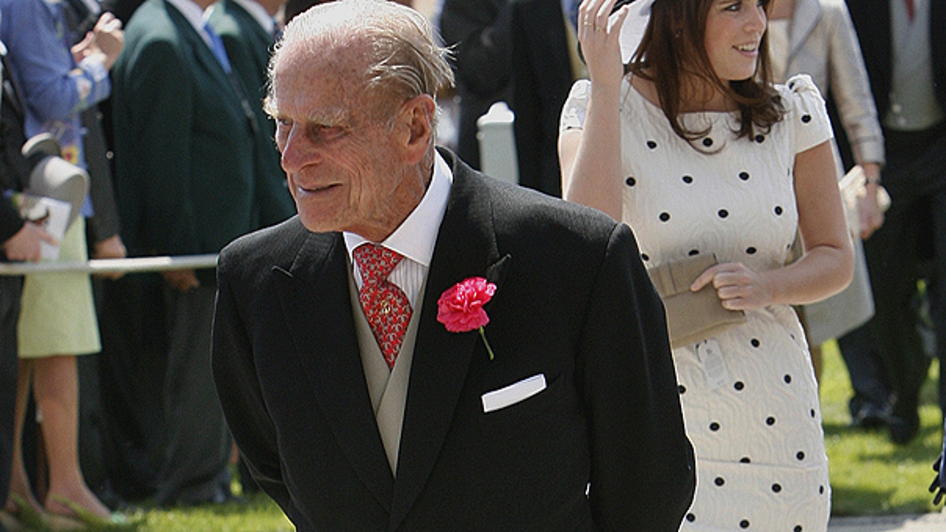 June 4: Britain's Prince Philip, the Duke of Edinburgh, left, and Princess Eugenie arrive on Derby Day at Epsom Downs Racecourse in Epsom, England.