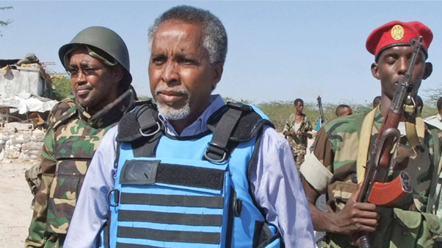 Feb. 23: Somalia's Interior Minister Abdishakur Sheik Hassan, center, is escorted by Somali soldiers in Mogadishu, Somalia.