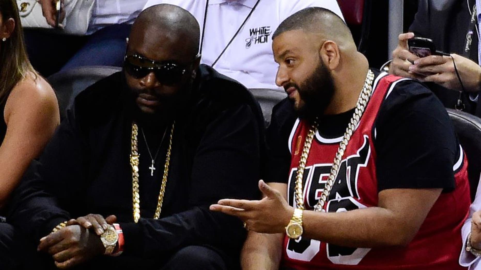 Jun 10, 2014; Miami, FL, USA; Recording artists Rick Ross (left) and DJ Khaled (right) watch the game between the Miami Heat and the San Antonio Spurs during the second half of game three of the 2014 NBA Finals at American Airlines Arena. Mandatory Credit: Bob Donnan-USA TODAY Sports