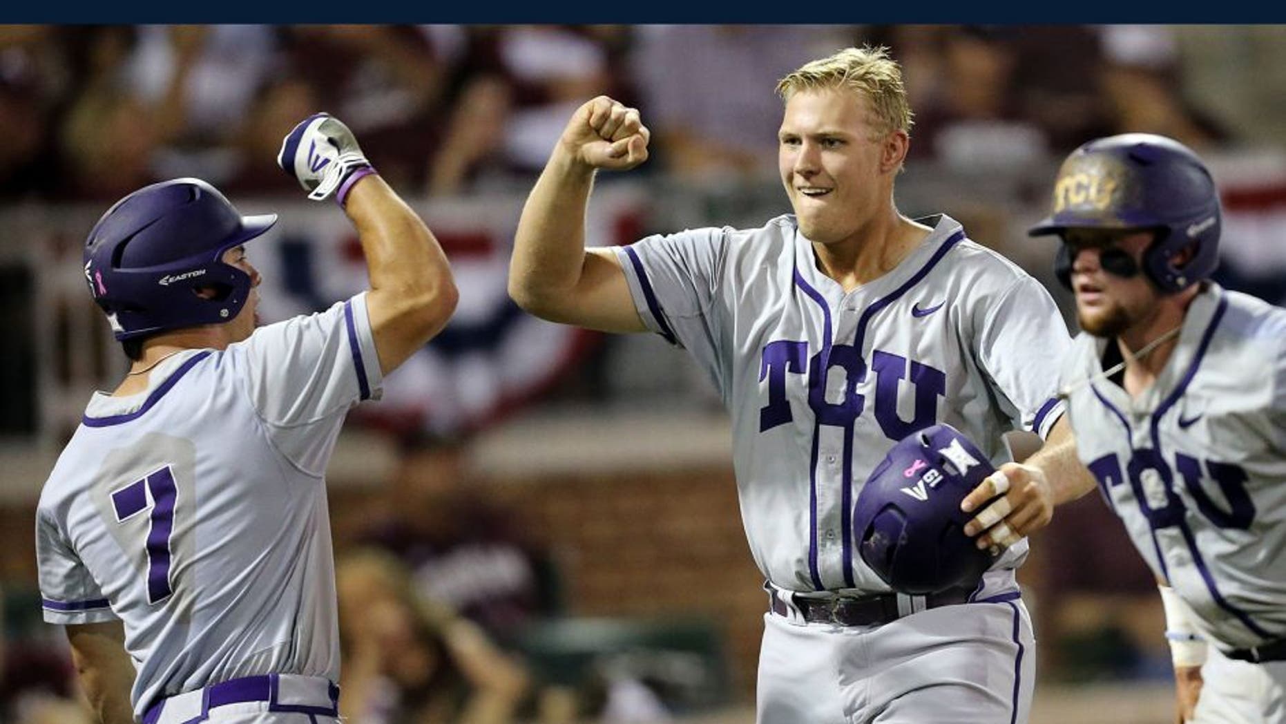TCU's Luken Baker (19) celebrates with teammate Josh Watson (7) after a three run homer against Texas A&M during the third inning of an NCAA Super Regional baseball tournament game, Friday, June 10, 2016, in College Station, Texas. (AP Photo/Sam Craft)