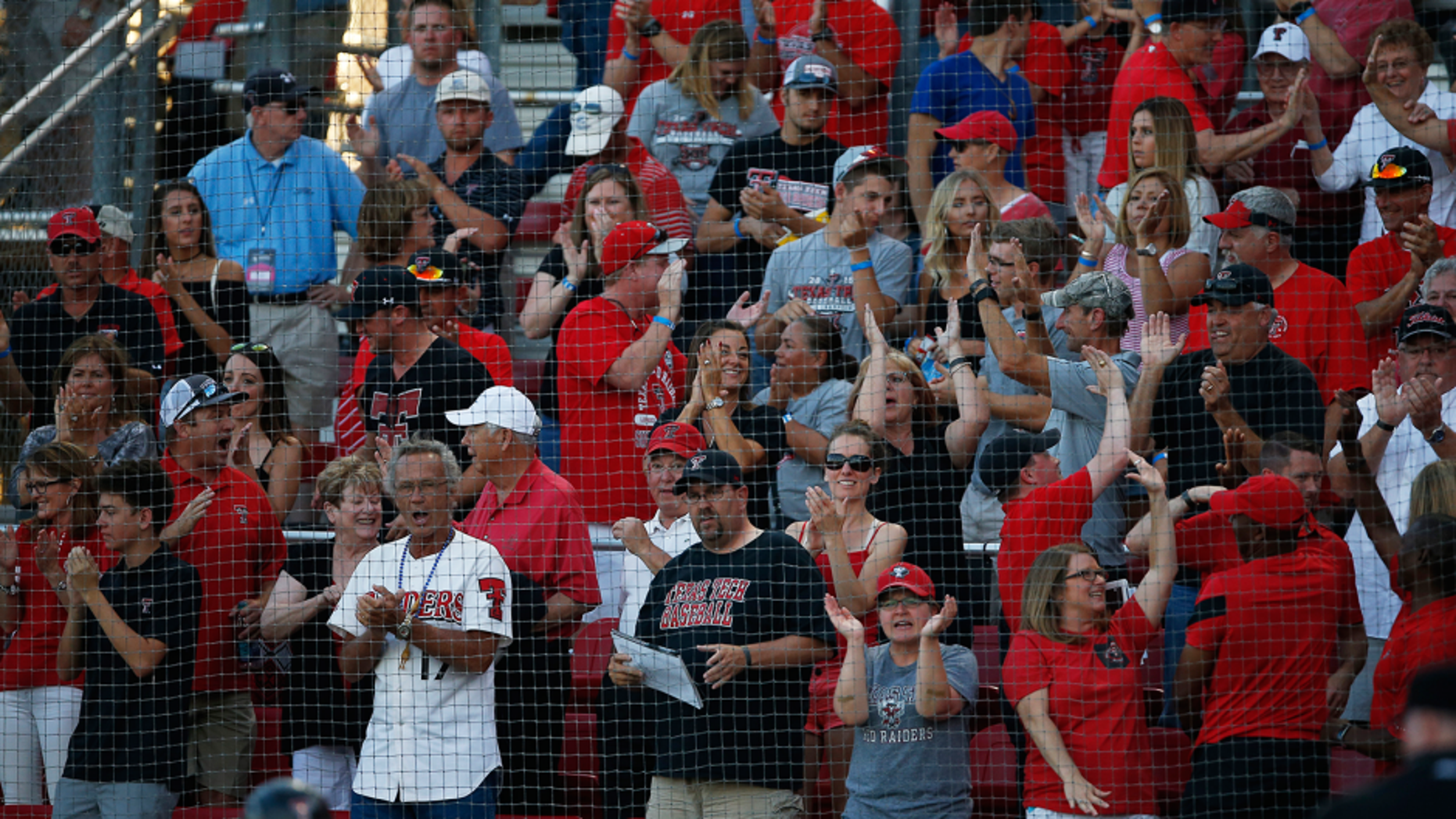 Texas Tech fans celebrate after Michael Davis hit a home run during an NCAA college baseball tournament super regional game against East Carolina, Friday, June 10, 2016, in Lubbock, Texas. (Brad Tollefson/Lubbock Avalanche-Journal via AP) ALL LOCAL TELEVISION OUT; MANDATORY CREDIT