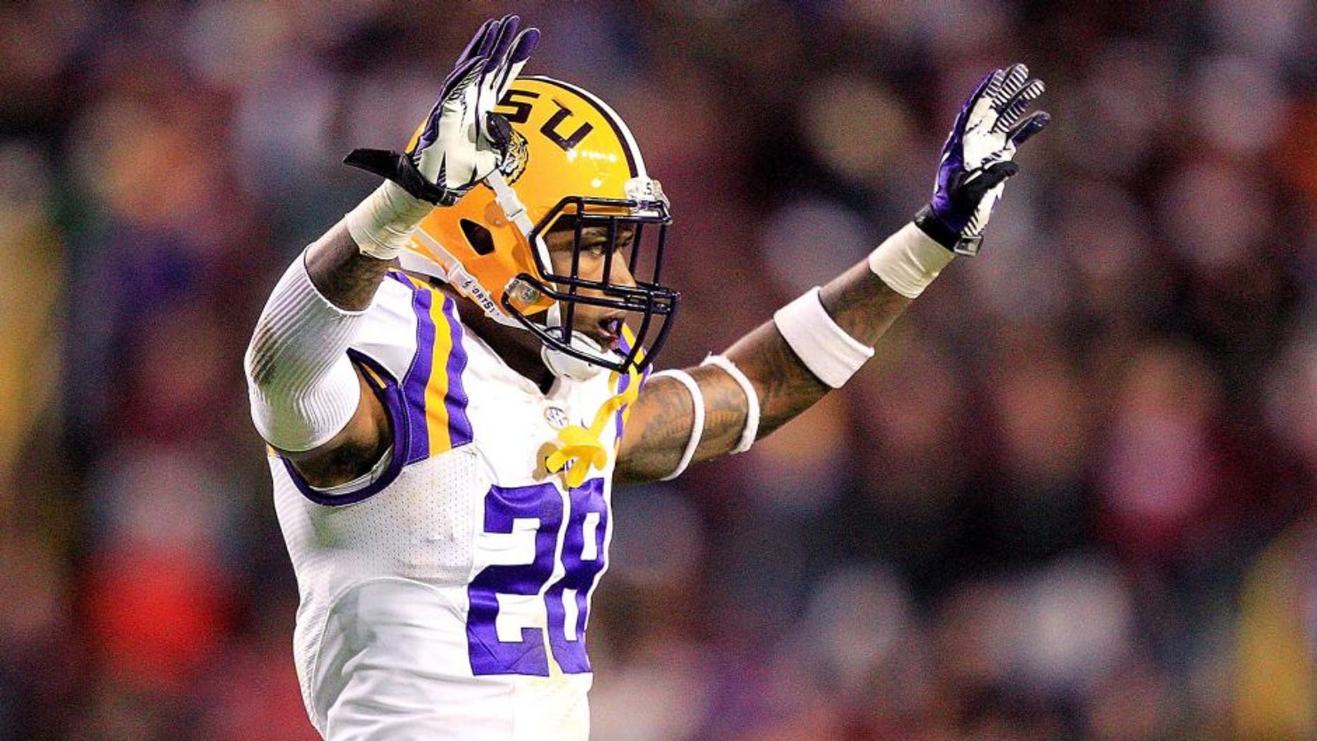 BATON ROUGE, LA - NOVEMBER 23: Cornerback Jalen Mills #28 of the LSU Tigers celebrates while taking on the Texas A&M Aggies at Tiger Stadium on November 23, 2013 in Baton Rouge, Louisiana. (Photo by Sean Gardner/Getty Images)