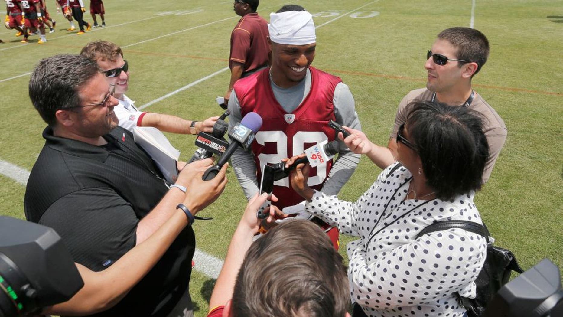 May 26, 2015; Ashbury, VA, USA; Washington Redskins cornerback Chris Culliver (29) speaks with the media after the Redskins OTA at Redskins Park. Mandatory Credit: Geoff Burke-USA TODAY Sports