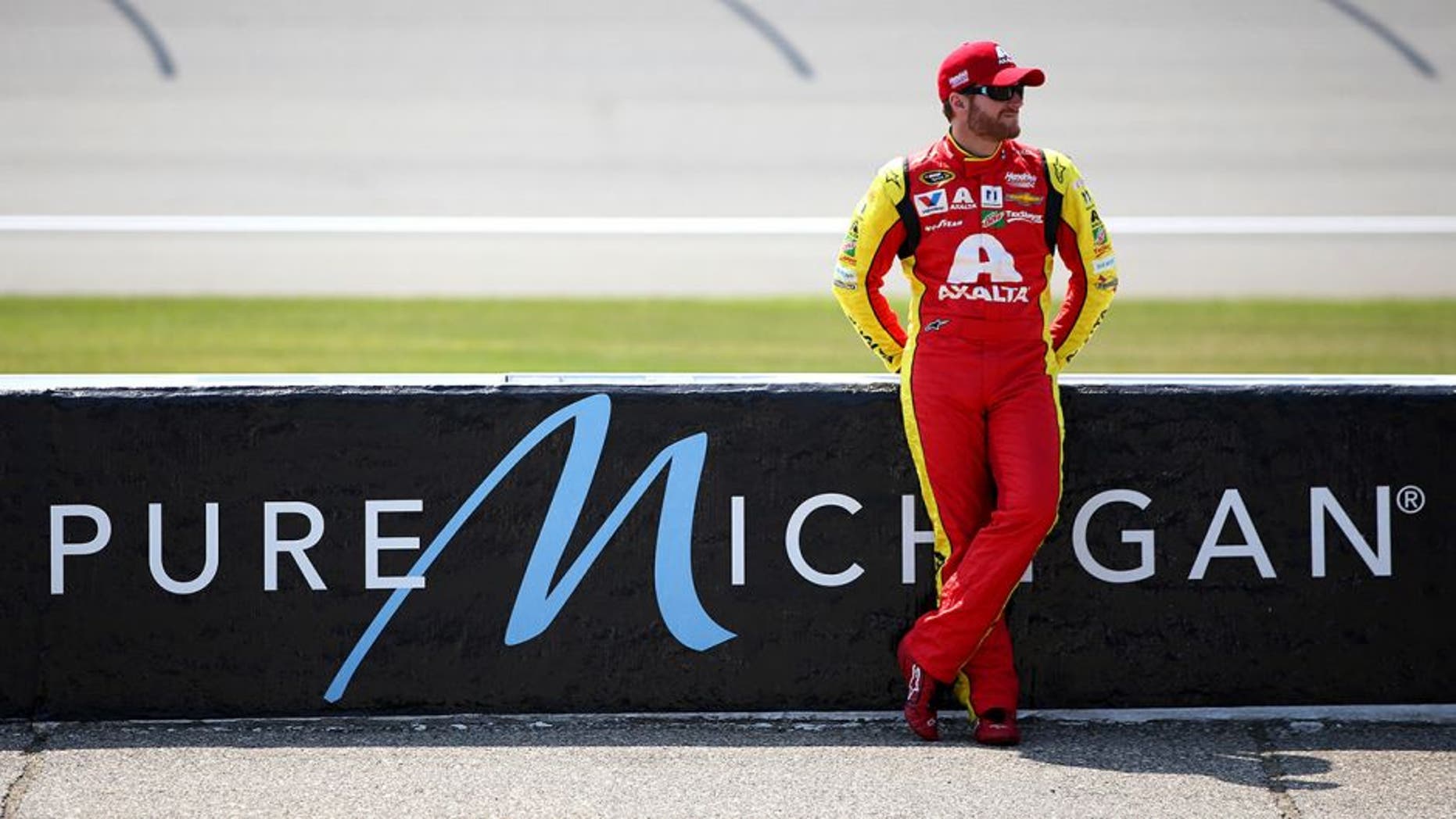 BROOKLYN, MI - JUNE 10: Dale Earnhardt Jr, driver of the #88 Axalta Chevrolet, stands on the grid during qualifying for the NASCAR Sprint Cup Series FireKeepers Casino 400 at Michigan International Speedway on June 10, 2016 in Brooklyn, Michigan. (Photo by Sean Gardner/NASCAR via Getty Images)