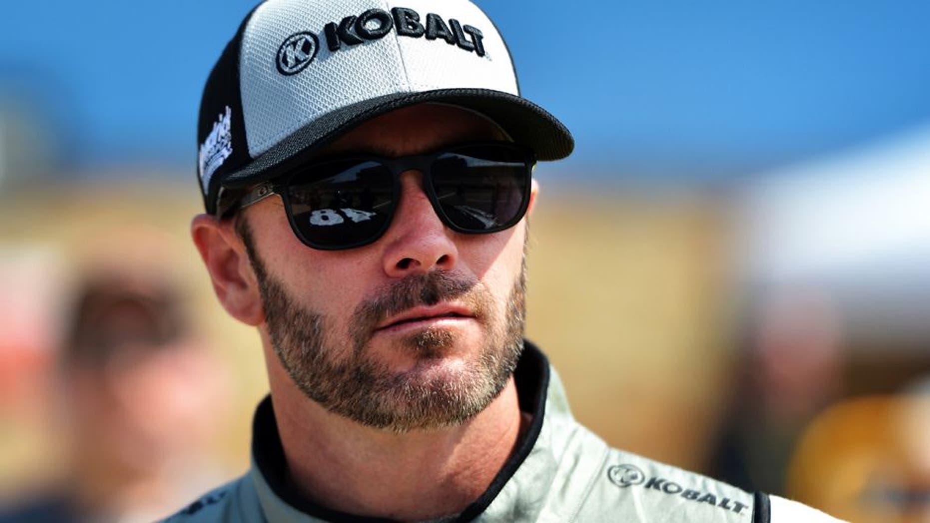 BROOKLYN, MI - JUNE 10: Jimmie Johnson, driver of the #48 Kobalt Chevrolet, stands on the grid during qualifying for the NASCAR Sprint Cup Series FireKeepers Casino 400 at Michigan International Speedway on June 11, 2016 in Brooklyn, Michigan. (Photo by Drew Hallowell/Getty Images )