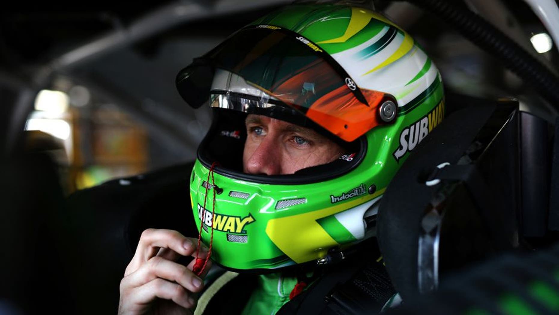 BROOKLYN, MI - JUNE 11: Carl Edwards, driver of the #19 Subway Toyota, sits in his car during practice for the NASCAR Sprint Cup Series FireKeepers Casino 400 at Michigan International Speedway on June 11, 2016 in Brooklyn, Michigan. (Photo by Rey Del Rio/Getty Images )