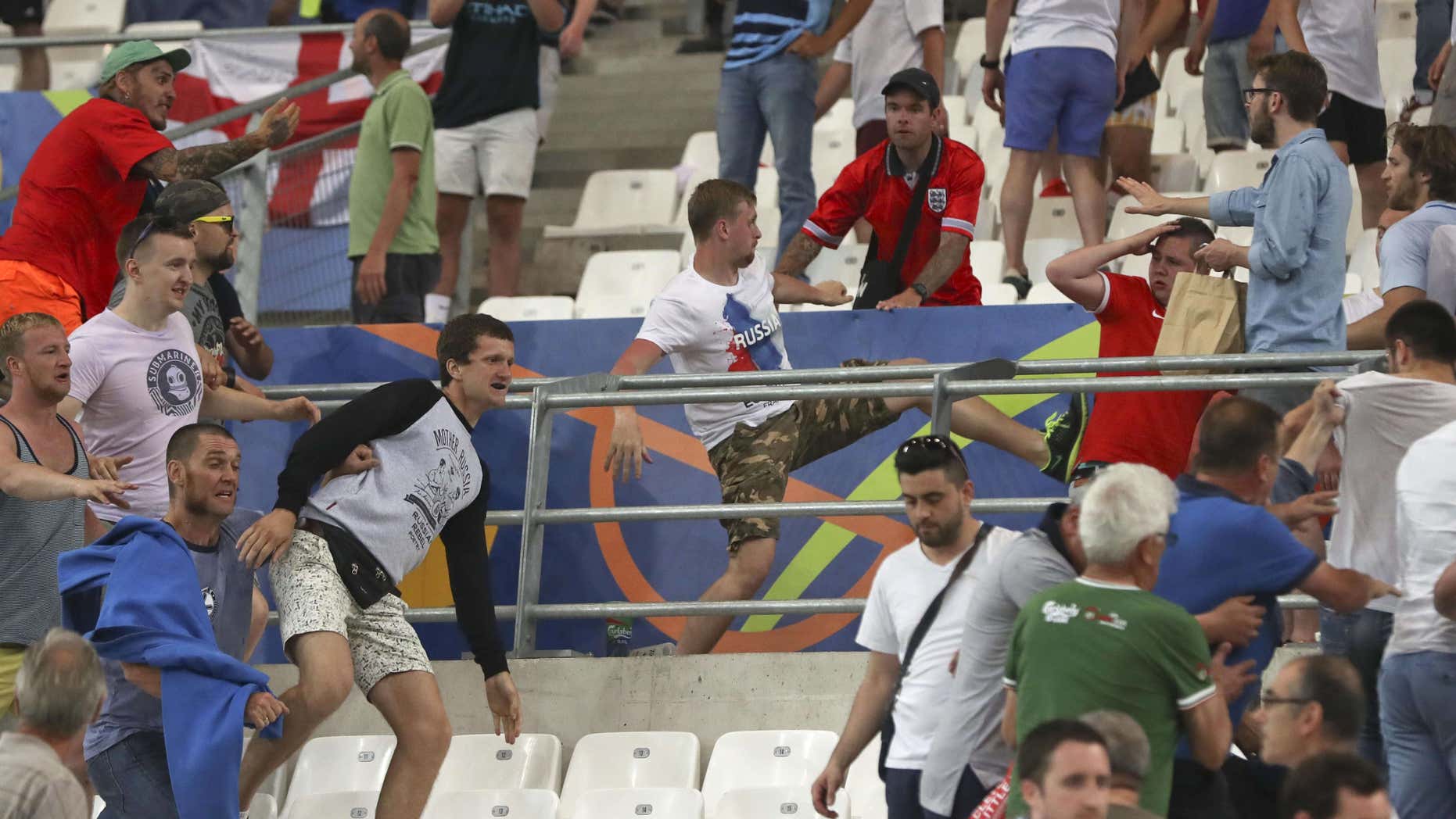 Clashes break out in the stands during the Euro 2016 Group B soccer match between England and Russia, at the Velodrome stadium in Marseille, France, Saturday, June 11, 2016.
