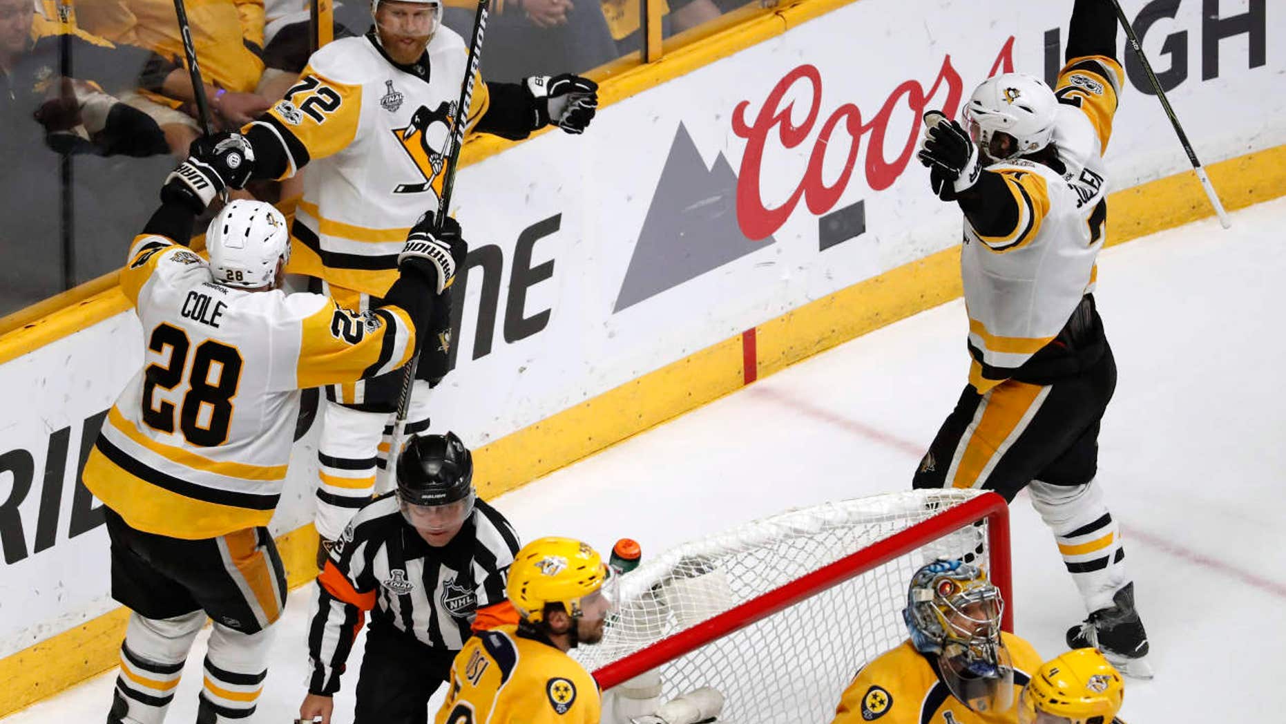 Pittsburgh Penguins' Patric Hornqvist (72), of Sweden,celebrates with Ian Cole (28) after scoring a goal against the Nashville Predators during the third period of Game 6 of the NHL hockey Stanley Cup Final, Sunday, June 11, 2017, in Nashville, Tenn.