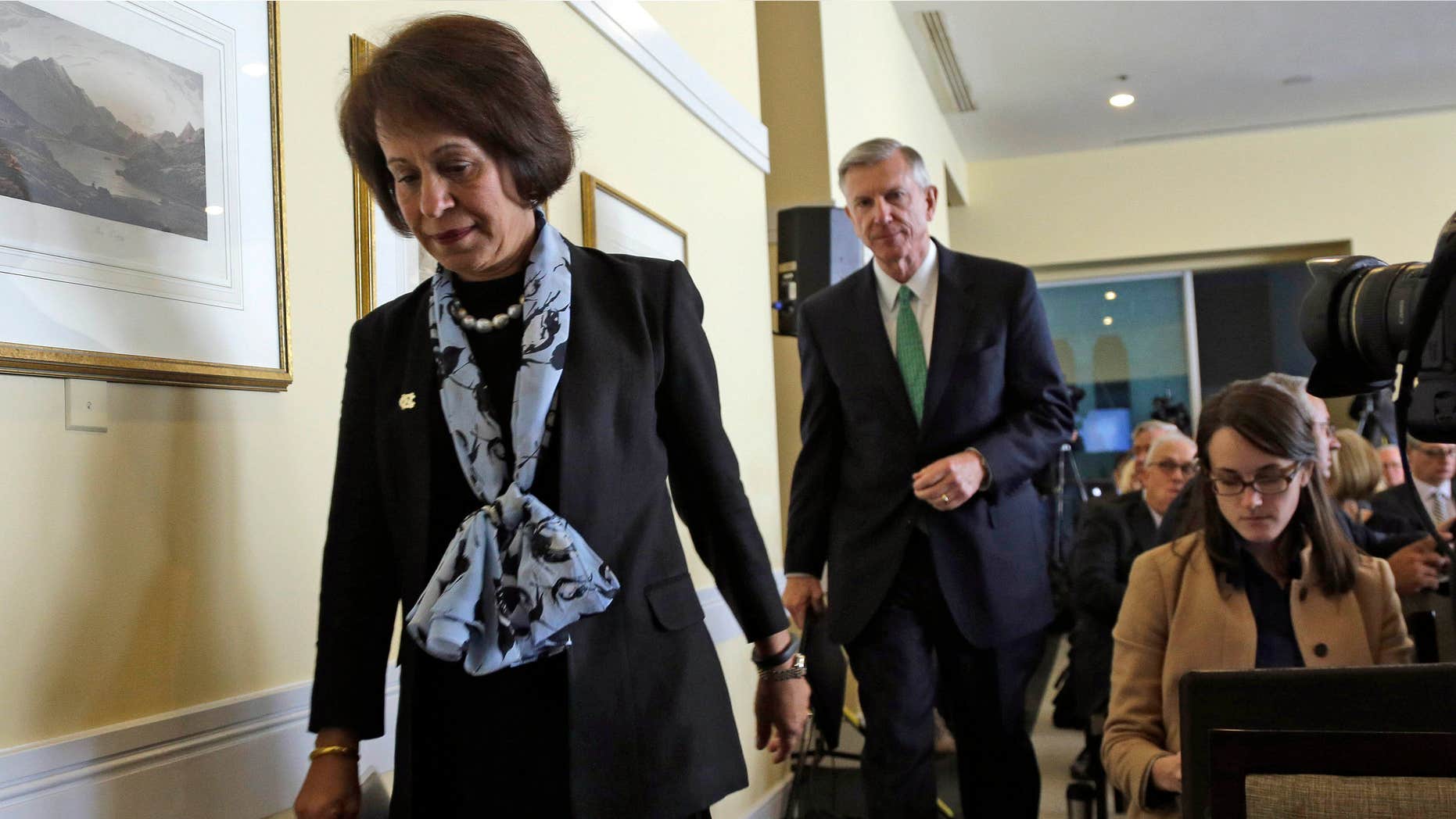 Oct. 22, 2014: University of North Carolina Chancellor Carol Folt, left, and President Tom Ross prepare to address members of the media with results of an investigation into academic irregularities following a special joint meeting of the University of North Carolina Board of Governors and the UNC-Chapel Hill Board of Trustees in Chapel Hill, N.C.